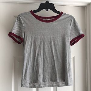 Black and white stripped shirt with red trimming